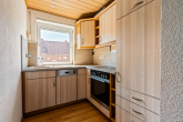 Küche - Wohnen mit Mehrwert – 3-Zimmer-Eigentumswohnung inklusive Garage und kleiner Gartenfläche