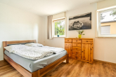 Schlafzimmer - Ferienbungalow nahe der Müritz mit Bootsliegeplatz – sofort urlaubsbereit