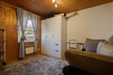 Schlafzimmer I - Wo Sommer nach Kaminofenduft und Seeluft schmeckt: Ferienhaus in Granzow