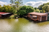 Bild - Ihr Rückzugsort am Wasser – Bootshaus mit integrierter Bootsbox